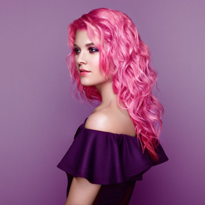 Beauty Fashion Model Girl with Colorful Dyed Hair. Girl with perfect Makeup and Hairstyle. Model with perfect Healthy Dyed Hair. Pink Hairstyles